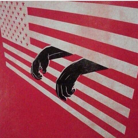 America - Worlds Largest Police State - American flag with prison bars and prison arems clenched fist USA flag with prison bars